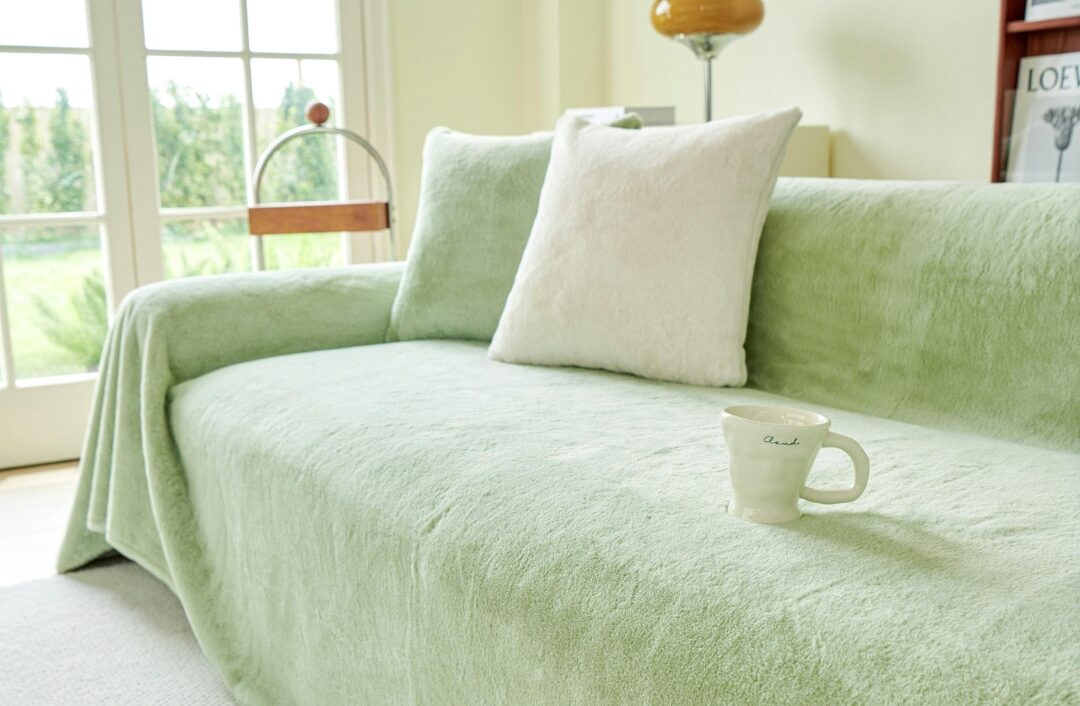 relaxed white linen slipcovered armchair with throw pillow in bright corner exploring 40 cozy home ideas you'll want to copy