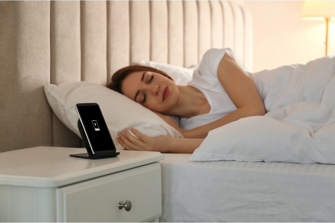 smartphone sitting quietly on wooden nightstand near sleeping lamp keeping digital boundaries