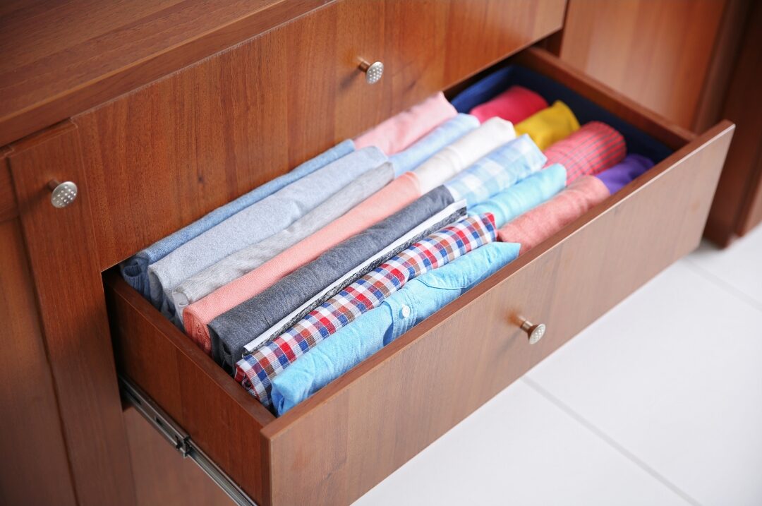 neatly folded neutral seamless cotton undergarments in drawer showcasing 30 tiny luxuries every woman deserves