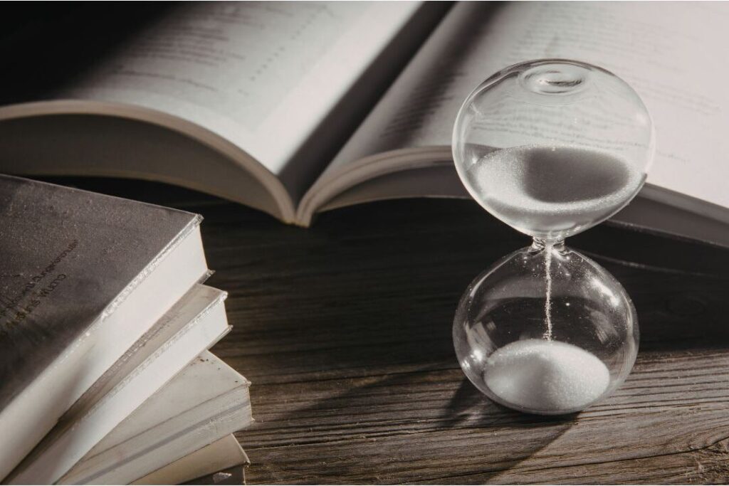 wooden hourglass on desk representing 72 hour purchase pause rule