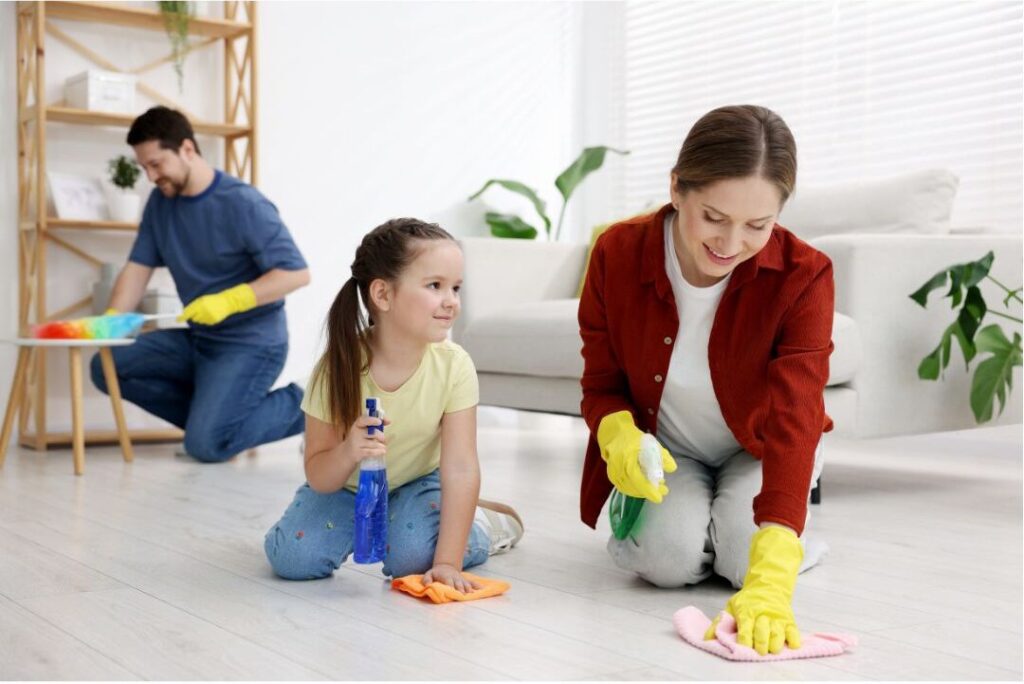 family working together tidying up bright living room area discovering nobody talks about this reason moms feel exhausted