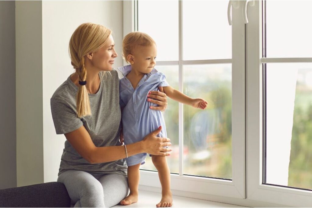 mother holding toddler peacefully applying things frugal moms never waste money on