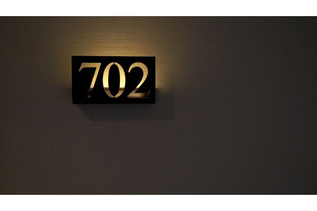 solar house number plaque glowing near front gate