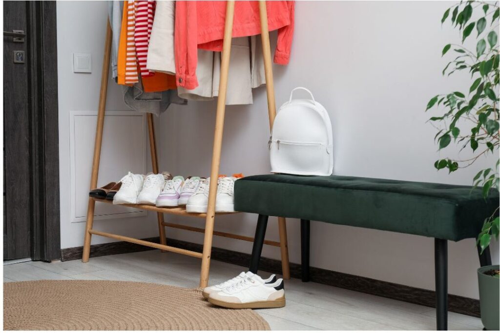 organized entryway table with prepped backpack and clean shoes underneath