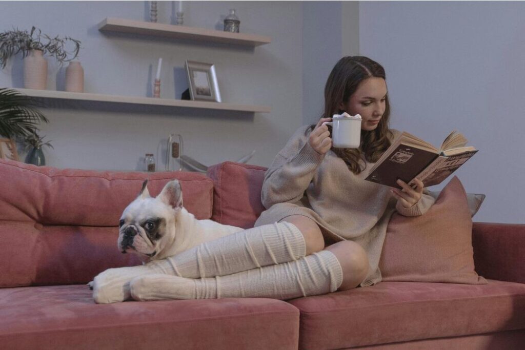 woman relaxing peacefully on couch avoiding late night impulse shopping