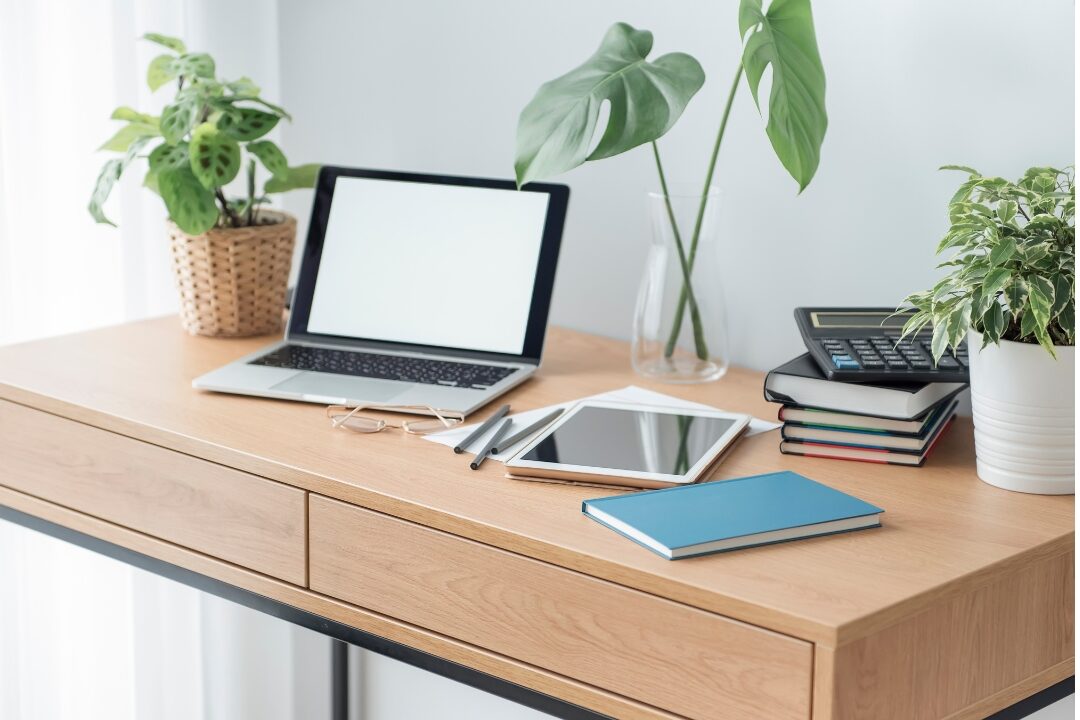 modern desk space with digital devices representing app subscriptions