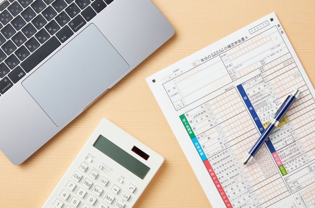 fiduciary tax paperwork organized neatly on wooden table