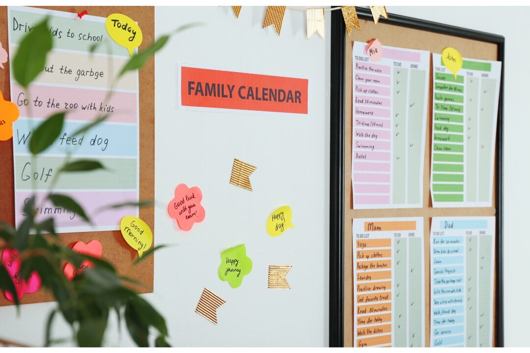organized family wall command center with chalkboard calendar and wooden bins displaying the family command center every busy home needs