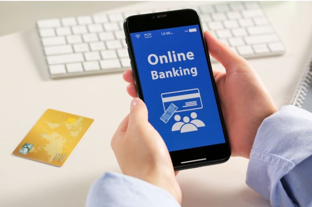 hands holding phone checking account balance during weekly money reset