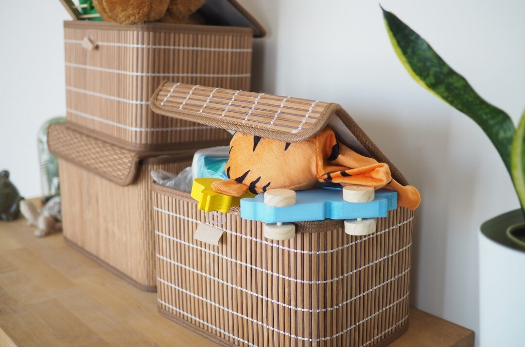 tidy kids toy corner with fabric bins holding organized wooden blocks