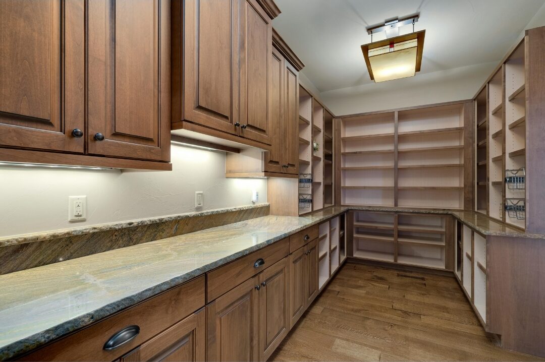 open wooden kitchen shelves illuminated underneath by warm hidden LED strip lighting