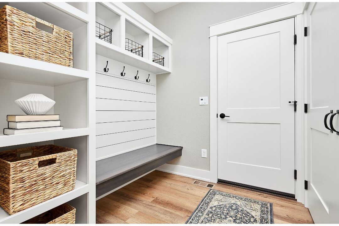 white beadboard paneling in entryway mudroom with coat hooks featuring 70 budget-friendly home upgrades that are actually worth it